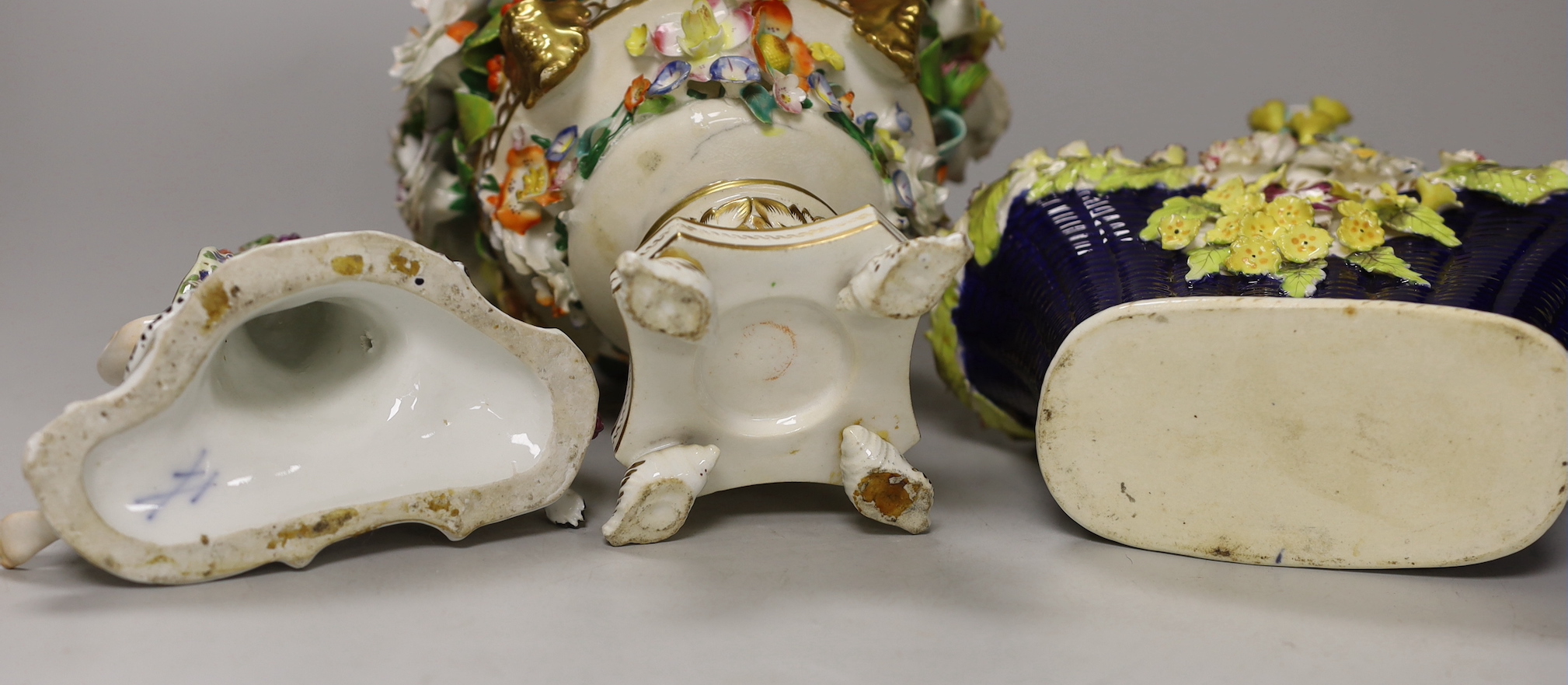 A Rockingham style floral encrusted basket, a Dresden floral centrepiece and a Meissen putti and leopard (a.f.), centrepiece 19cm high